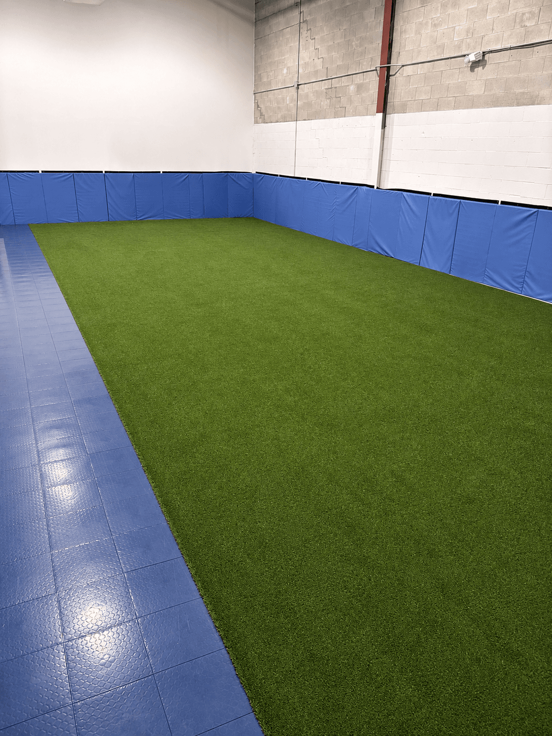 Mini Mavericks indoor turf area next to the mini basketball court